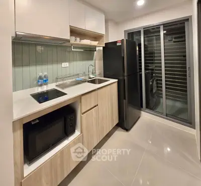 Modern kitchen with sleek appliances and open layout design