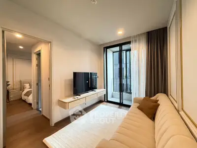 Modern living room with elegant decor and balcony access in a stylish apartment