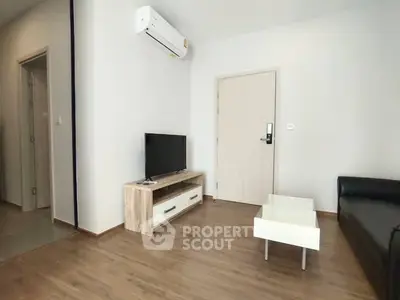 Modern living room with sleek furniture and air conditioning in a stylish apartment.