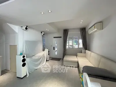 Spacious living room with modern decor and natural light