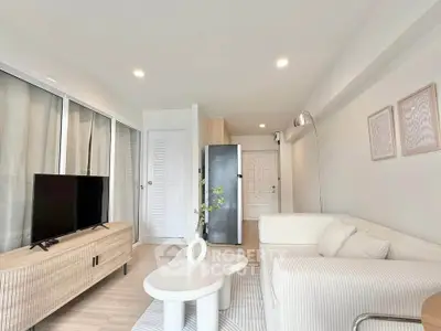 Modern living room with stylish furniture and natural light, perfect for relaxation and entertainment.