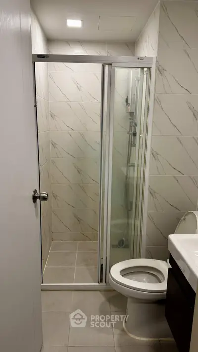 Modern bathroom with sleek shower and elegant tile design