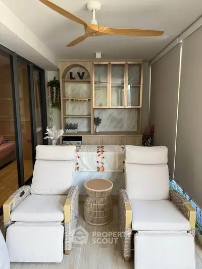 Cozy living room with stylish recliners and elegant decor, perfect for relaxation and comfort.