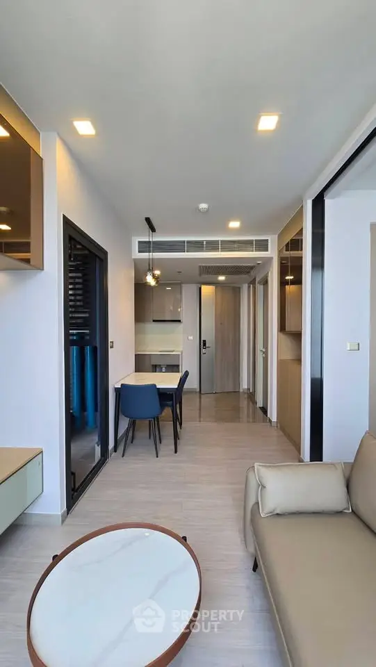 Modern living room with open layout and stylish furniture in a contemporary apartment.