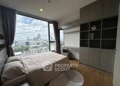 Modern bedroom with stunning city view and elegant built-in storage