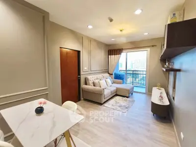 Modern living room with elegant decor and balcony view in a stylish apartment.