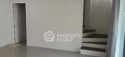 Minimalist interior with staircase and open door in modern home