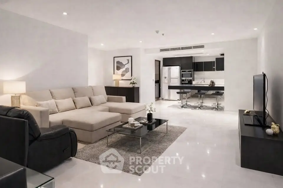 Spacious modern living room with open kitchen and elegant decor
