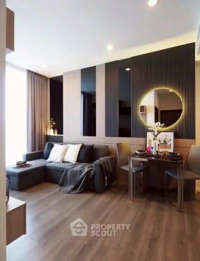 Modern living room with stylish decor and cozy seating area, perfect for relaxation and entertaining.
