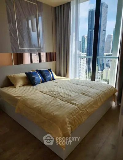 Luxurious bedroom with city view and elegant decor in high-rise apartment