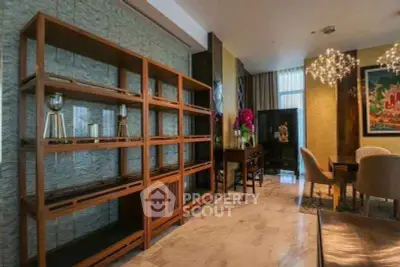 Luxurious living room with elegant decor and modern lighting in a high-end apartment.