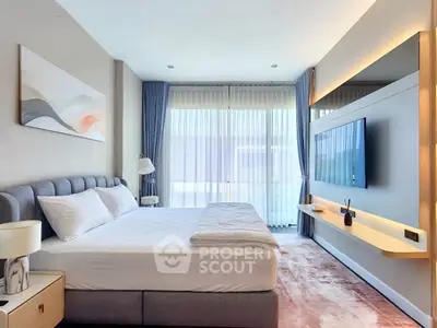 Luxurious modern bedroom with elegant decor and large windows for natural light.