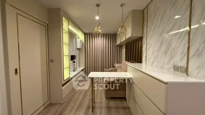 Modern living room with elegant lighting and marble accents