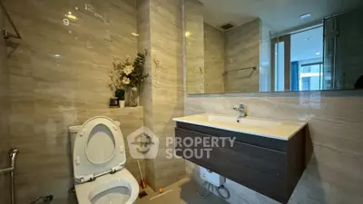 Modern bathroom with sleek fixtures and elegant marble tiles