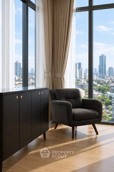 Modern living room with city view, featuring stylish armchair and sleek cabinet.
