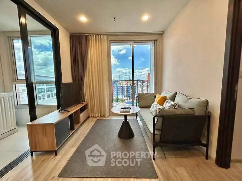 Modern living room with stunning city view and cozy furnishings