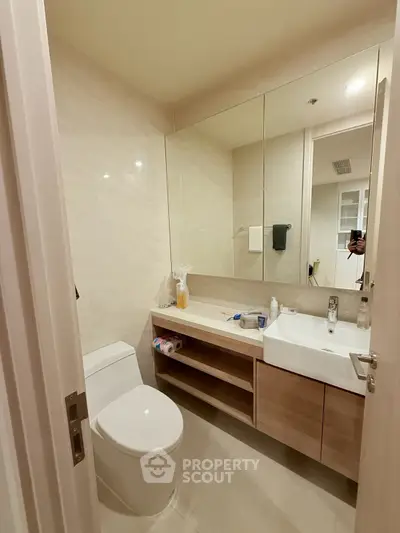 Modern bathroom with sleek fixtures and ample storage space