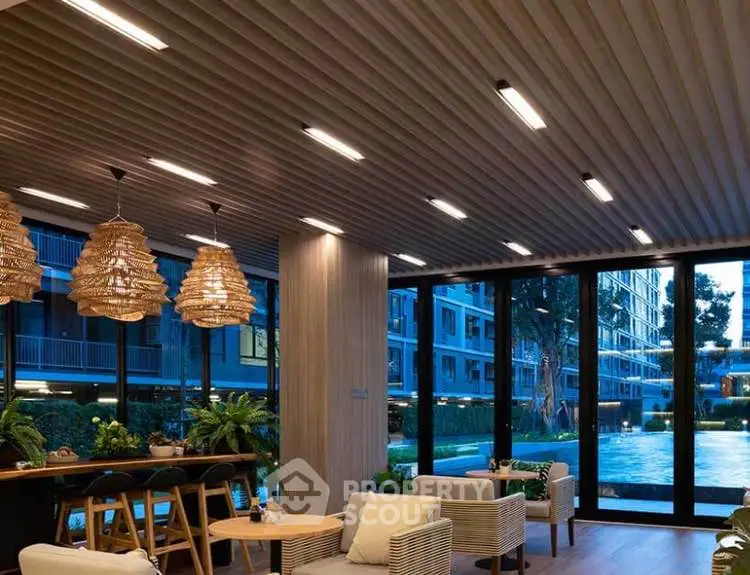 Luxurious modern living room with pool view and stylish lighting