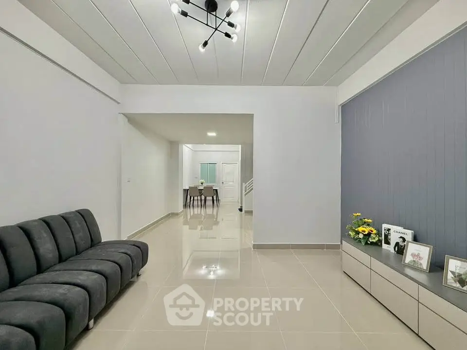 Spacious modern living room with sleek design and elegant lighting