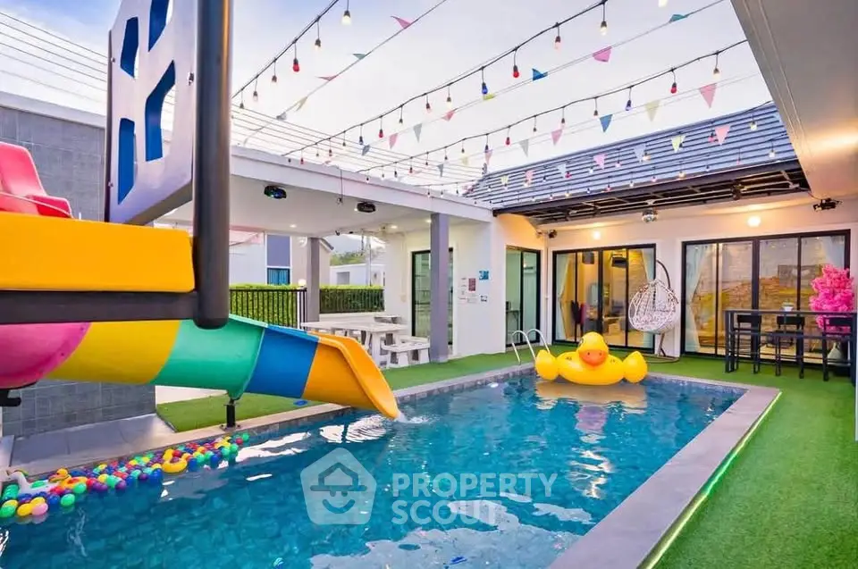 Charming modern home with private pool and playful slide, perfect for family fun and relaxation.