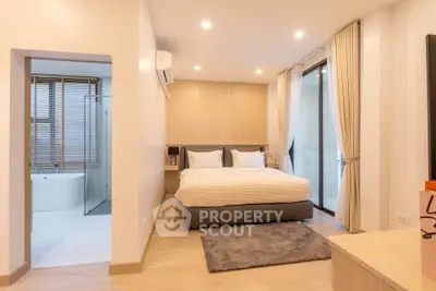 Luxurious modern bedroom with ensuite bathroom and elegant decor