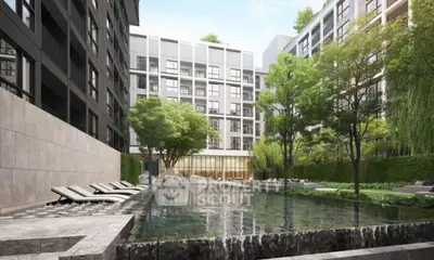 Luxurious apartment complex with serene pool and lush greenery