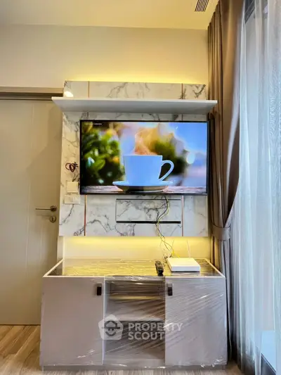 Modern living room with mounted TV and stylish marble wall design
