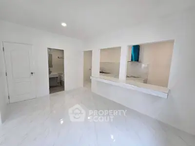 Modern kitchen with open layout and sleek marble flooring