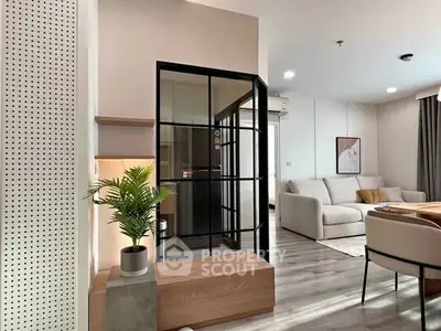 Modern living room with stylish decor and glass partition