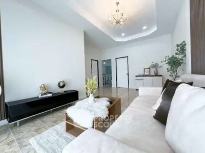 Elegant living room with modern decor and plush seating, perfect for relaxation.