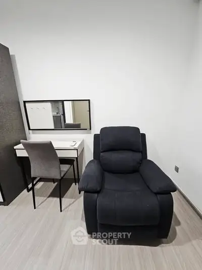 Modern study area with sleek desk and comfortable recliner chair