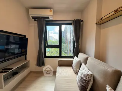 Cozy living room with modern decor and large window view