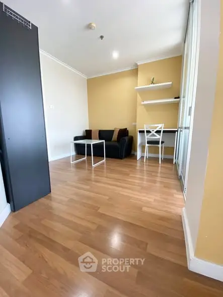 Modern living room with wooden flooring and minimalist furniture