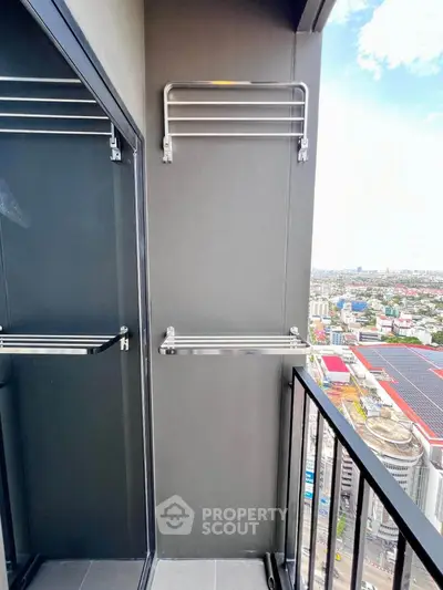 Modern balcony with city view and sleek metal racks, perfect for urban living.