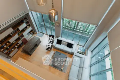 Luxurious modern living room with high ceilings and large windows