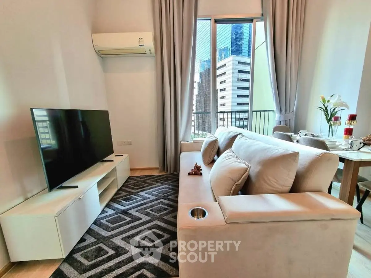 Modern living room with city view, stylish furniture, and natural light.