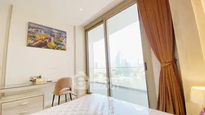 Luxurious bedroom with stunning city view and spacious balcony access.