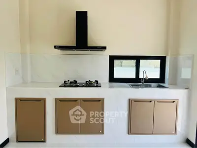 Modern kitchen with sleek cabinets and gas stove in a stylish apartment