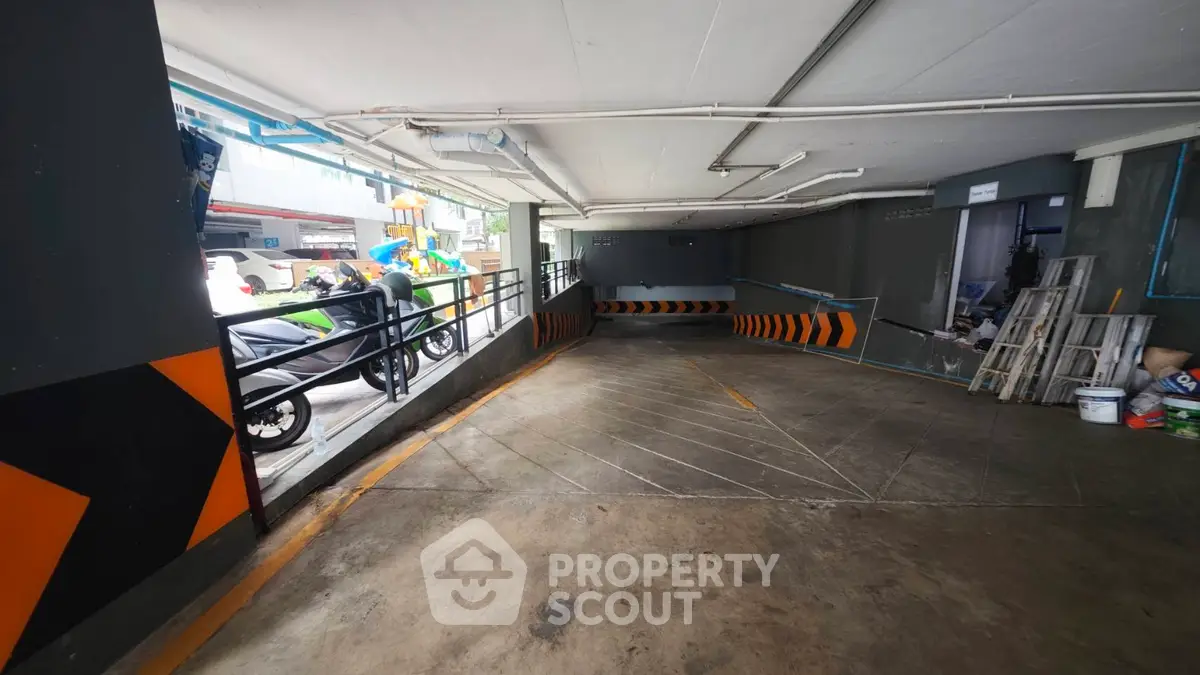 Spacious parking garage with ramp access and modern design elements
