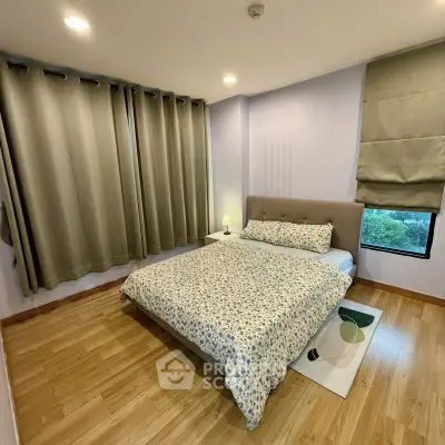 Cozy bedroom with wooden flooring and elegant curtains in modern apartment