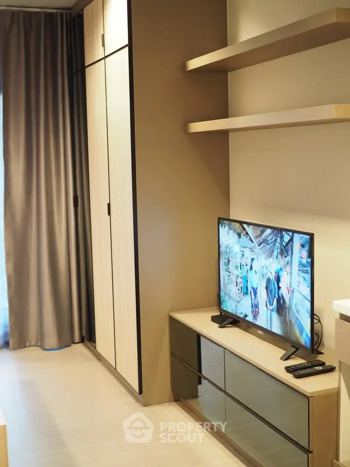 Modern living room with sleek TV stand and built-in storage cabinets