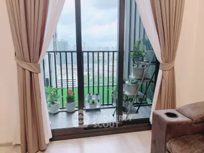 Stylish apartment balcony with city view and lush greenery, perfect for relaxation and enjoying urban living.