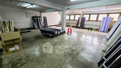 Spacious basement storage area with ample natural light and organized layout.