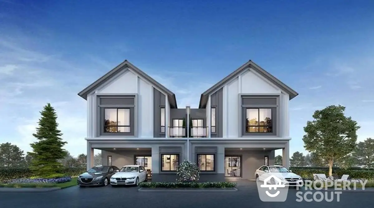 Modern duplex house with two-car garage and landscaped front yard