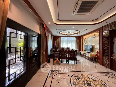 Luxurious living room with elegant decor and intricate ceiling design