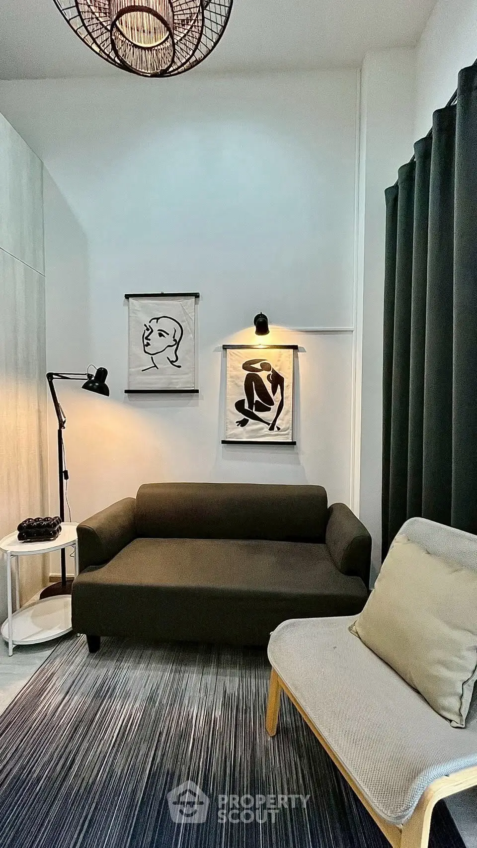 Chic modern living room with stylish decor and cozy seating area, perfect for relaxation and entertaining.