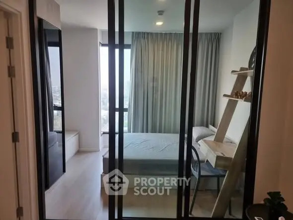 Modern bedroom with glass partition and stylish decor in urban apartment