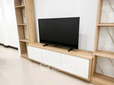 Modern living room with sleek TV unit and stylish shelving
