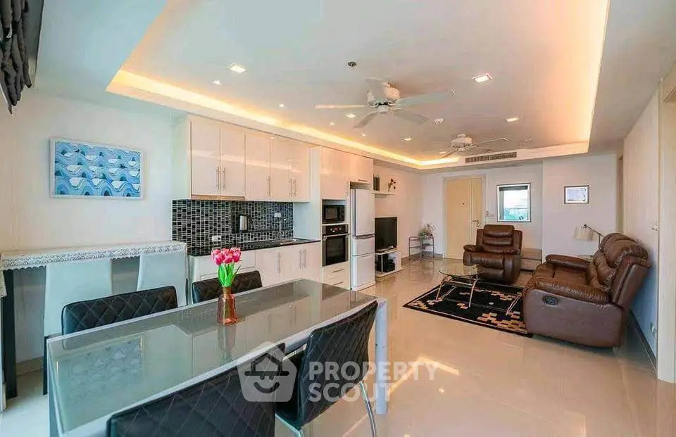 Spacious modern living room with open kitchen and stylish decor