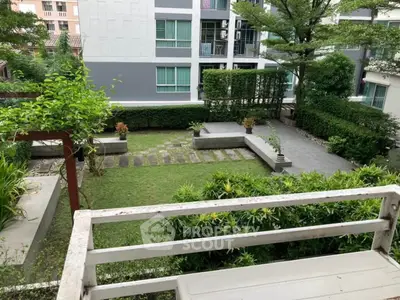 Charming garden view from balcony in modern residential complex